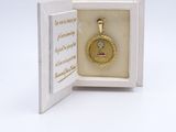 an image of a small gold locke with a small diamond in it