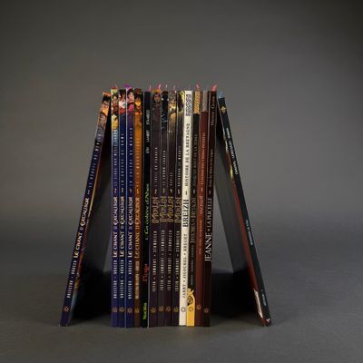 a stack of books sitting on top of each other on a table