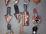 a lot of badges that are on a table