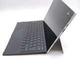 a laptop that has a keyboard on top of it