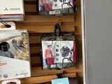 many bags hanging on the wall of a store