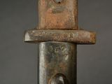 a close up picture of a metal object with a hole in it