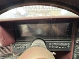 a view of a car ' s dashboard from inside the vehicle