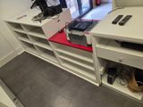 a desk with a computer and a printer on it