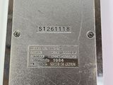 a close up of a metal plate with a number on it