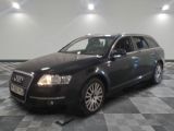 an image of a black audi wagon parked in a garage