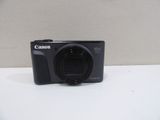 a close up of a camera on a table with a white background