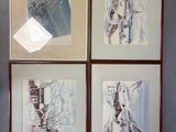 four framed pictures hanging on the wall of a room