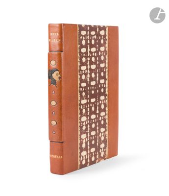 an old book with a brown cover sitting on top of a white surface
