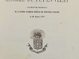 an old book with a black and white image of a coat of arms on it
