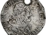 une pièce d'argent portant l'image d'un homme
