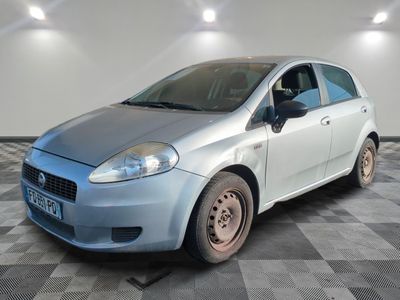 a picture of a silver car parked in a garage