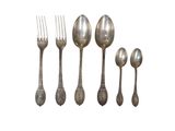 a set of five spoons and a fork on a white background