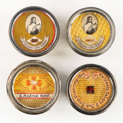 four tins of different types of tins with pictures on them
