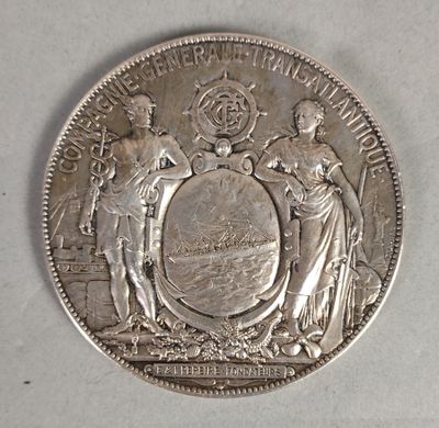 une pièce d'argent sur laquelle figurent des armoiries