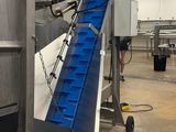 a picture of a conveyor belt in a factory