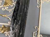 pair of black and white marble picture frames and a mirror