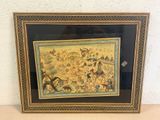 framed picture of a painting of a village scene with horses and people