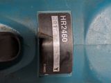 a close up of a blue electric drill on a table