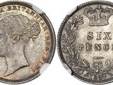 une pièce d'argent surmontée d'une couronne
