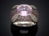 an image of a ring with a pink stone surrounded by pink and white diamonds