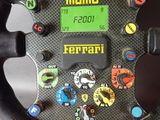 a close up of a steering wheel with buttons on it