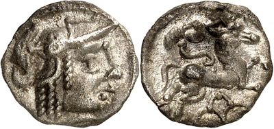 a silver coin with a head of a man on it