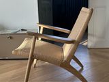 a chair that is sitting in the middle of a living room