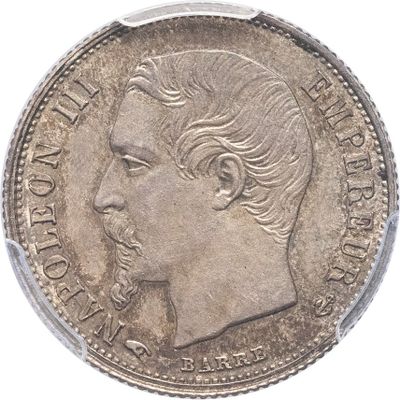 Gros plan sur une pièce de monnaie portant le visage d'un homme