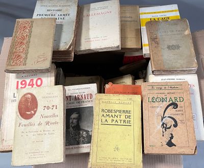 many old books stacked on top of each other on a table