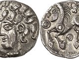 a silver coin with an image of a man on it