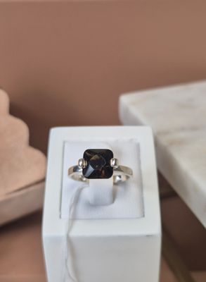 a ring that is sitting in a box on a table