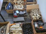 many boxes of wires and other electronics on the floor