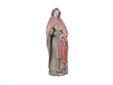 figurine d'une femme tenant un bébé dans ses bras