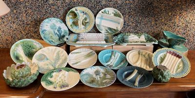 a lot of plates and bowls on the table