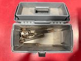 a metal box with a bunch of screws inside of it