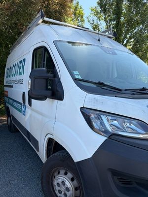 a white van parked on the side of the road