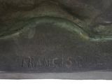 bronze statue of a dog with a name engraved on it ' s side