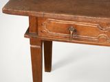an old wooden table with a drawer on top of it