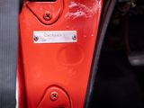 a close up of a red door handle on a motorcycle
