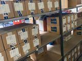boxes are stacked on a shelf in a warehouse with a lot of them