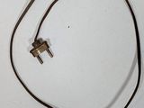 a cord with a plug attached to it on a white surface