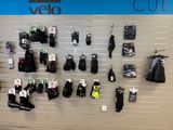 many pairs of gloves hanging on a wall in a store
