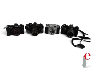three cameras sitting next to each other on a white surface