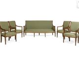 three chairs and a couch in a room with a white background