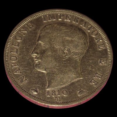 a close up of a coin with a man ' s face on it