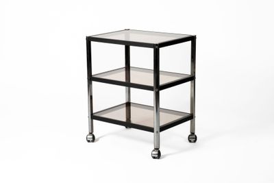 Henri ERARD (XXe) Table desserte en métal noir