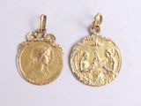 two gold coin pendants with the image of jesus and mary