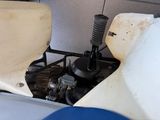 a close up of a motorcycle with a seat and a steering