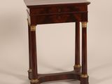an antique wooden table with a drawer on top of it